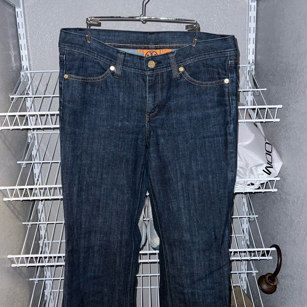Tory Burch Blue Jeans with gold colored hardware.